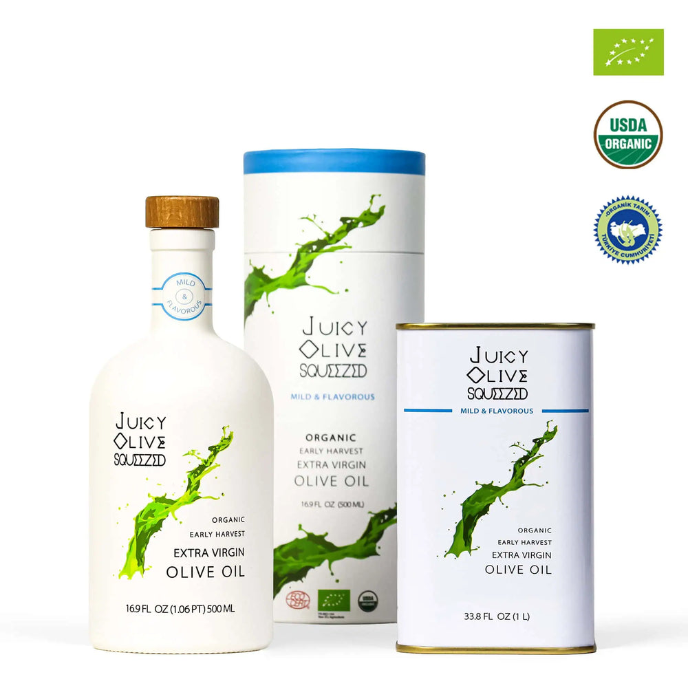 Juicy Olive Squezzid organic extra virgin olive oil set including a white bottle with a wooden cap, a white cylindrical tin with a blue lid, and a white rectangular can with a gold base, shown on a white background with USDA Organic and organic certification logos.