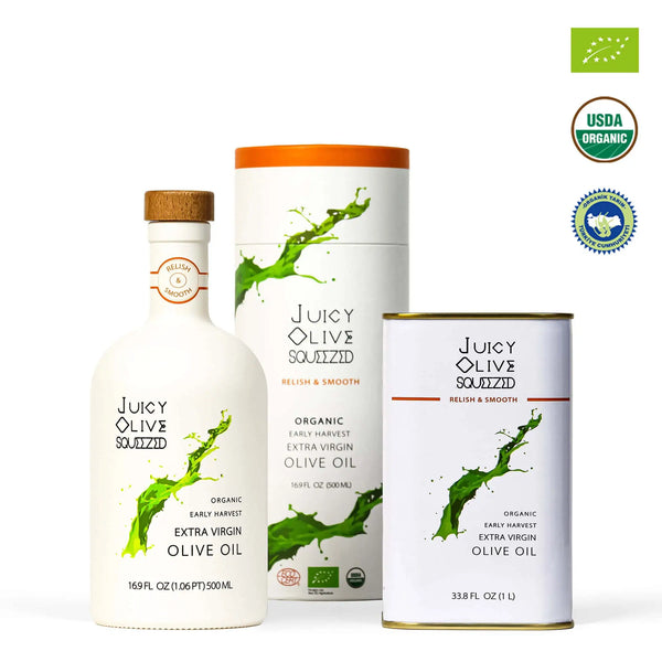 Juicy Olive Soluzzid organic extra virgin olive oil set including a 500ml white bottle with a cork stopper, a matching white cylindrical box with an orange lid, and a 12 fl oz can, shown alongside USDA Organic and Bio certification badges on a white background.