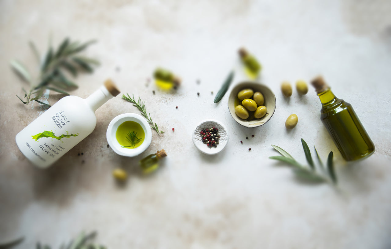 Green olives being milled in stainless steel machinery